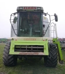 Зернозбиральний комбайн Claas Lexion 460, 1999 р.в. + жниварка С750, транспортний візок, б/в