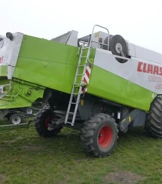 Зернозбиральний комбайн Claas Lexion 460, 1999 р.в. + жниварка С750, транспортний візок, б/в